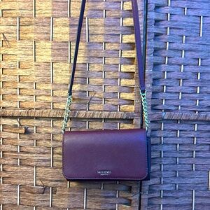 Kate Spade
Cherry juice colored
Ava flap chained wallet